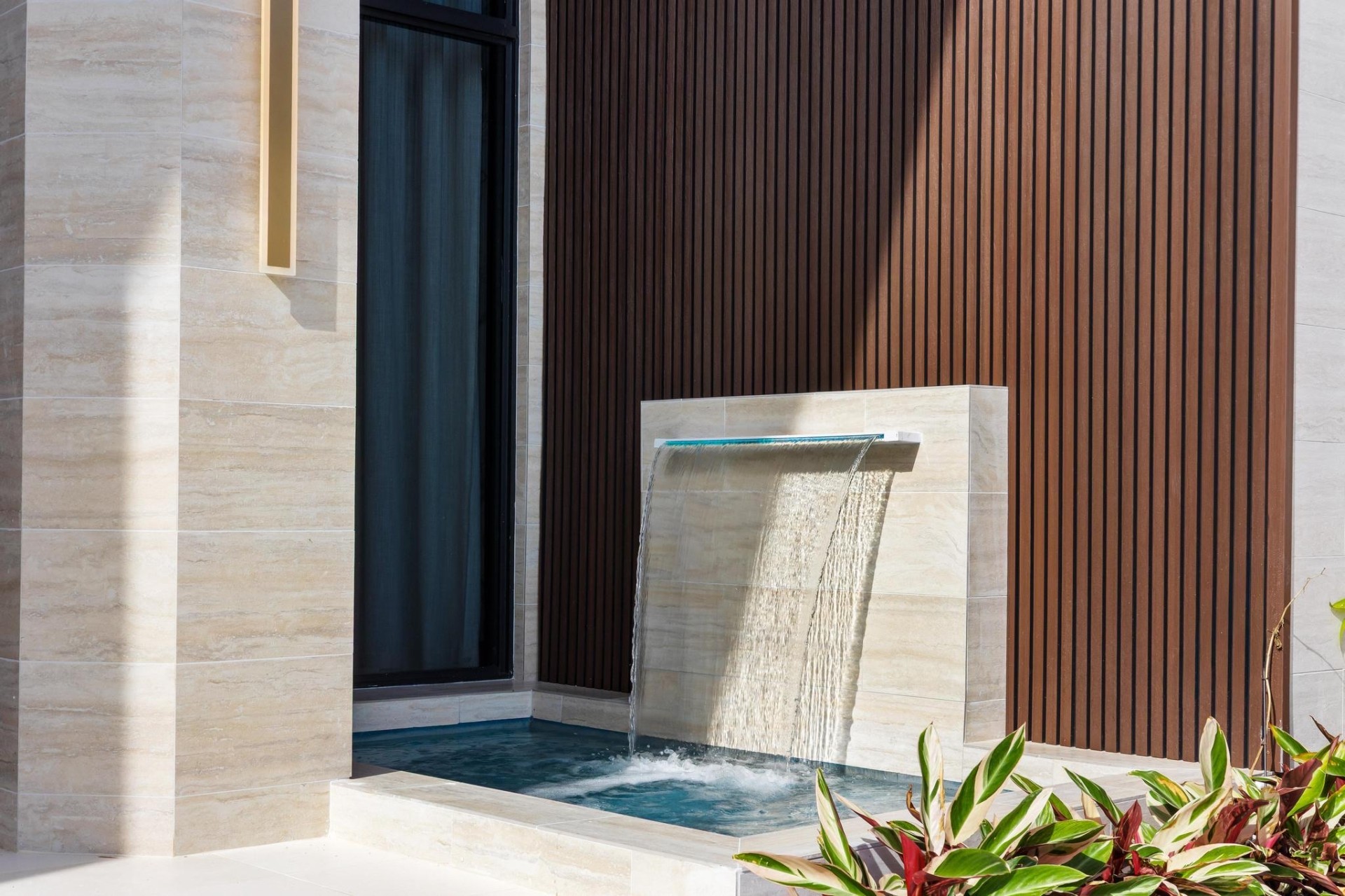 Composite cladding being installed on a modern exterior wall